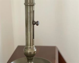 Antique tall brass push-up adjustable candle holder.