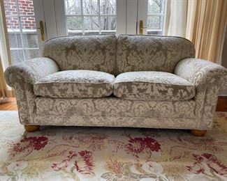Floral upholstered love seat. Measures 70" W x 36" D. Photo 1 of 2.
