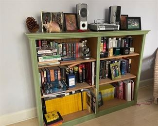 K. A. Roos green bookcase. Measures 56.5" W x 13.5" D x 42" H.