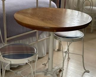 Antique oak top ice cream parlor table with wrought iron pedestal base and two twisted metal chairs. Table is 29" D. Photo 1 of 3.