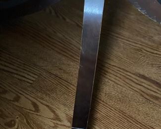 Leather top drum table with brass claw feet. Measures 28" D. Photo 3 of 3.