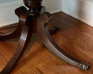 Leather top drum table with brass claw feet. Measures 28" D. Photo 2 of 3.