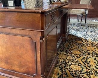 Flame Mahogany leather top desk with pull out tray. Measures 71" W x 36" D. Photo 4 of 4.
