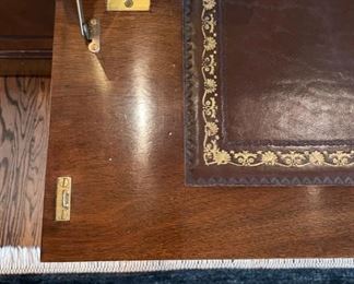 Trosby English traditional flame mahogany breakfront with leather-top drop-down desk / bar top and interior lighting. Measures 101" W x 88" W x 21" D. Photo 3 of 4.