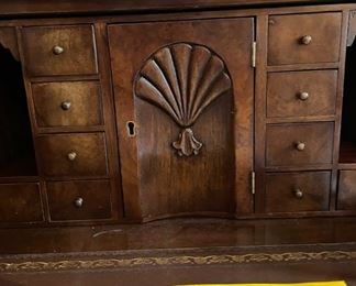 Trosby English traditional flame mahogany breakfront with leather-top drop-down desk / bar top and interior lighting. Measures 101" W x 88" W x 21" D. Photo 4 of 4.