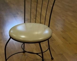 Set of 4 metal frame chairs with vegan leather upholstered seats. Seat height measures 18."