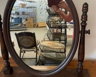 Antique wooden swivel mirror.