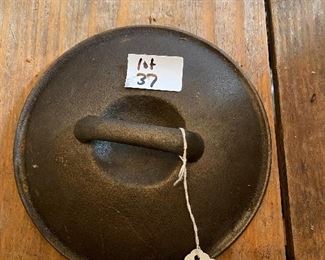 Cast iron pot lid @7 1/2” R no marks
