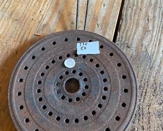 Early pressed tin trivet
