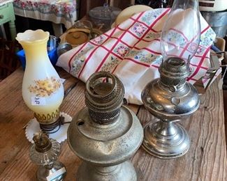 Set of 4 oil lamps - small glass and metal, converted milk glass, 2 metal Aladdin 
