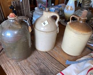 Choice of 3 excellent condition whiskey jugs glazed with handles 
