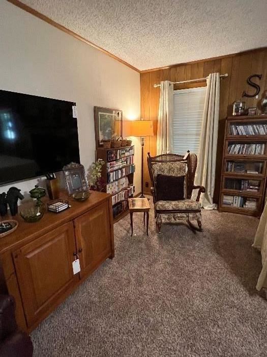 Smart TV, Entertainment Center, Vintage Cane & Wicker Rocker, Musical Inlaid Jewelry Box Side Table, Lawyers Bookshelf, Hundreds kid Books on Disc, Floor Lamp