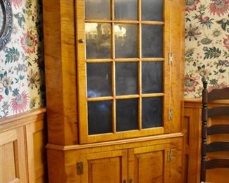 Eldred Wheeler tiger maple glazed corner cupboard