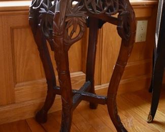 Carved plant stand