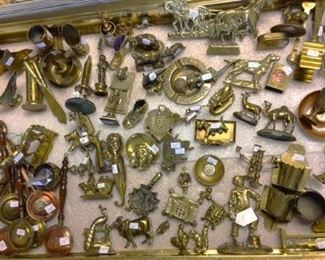 Just a sampling of some of the antique brass items...trench art, figurines, doorknockers, horse medallions, match safes, tools, dishes and more
