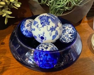 Blue and White Ceramic Balls in A Cobalt Blue Bowl