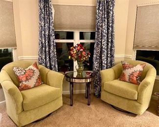 Two upholstered swivel club chairs & mirrored end table 