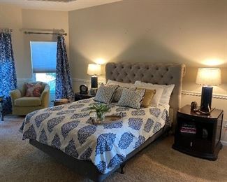 Master bed set with Peacock Alley neutral shams, upholstered tufted king size headboard and queen size mattress
