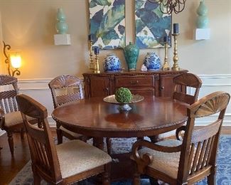 Lovely cherry round dining room table. Has center leaf and seats 8 comfortably. 
