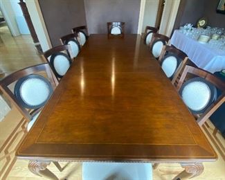 Baker dining table with 10 custom made chairs.  