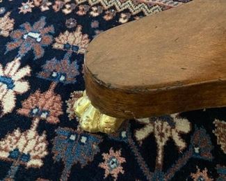 Detail of feet on occasional table between Horchow chairs