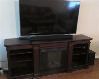 Media console with heating faux fireplace