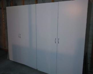 Large white storage cabinets