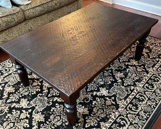 textured wood coffee table - heavy and well made over area rug