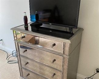 Mirrors on the dresser, pink champagne on ice.