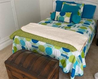 Cute bed and treasure chest.