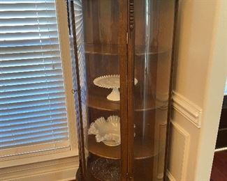 Antique oak curio cabinet.