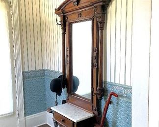 This late 1800s hall tree is in excellent condition. Beautiful walnut. Impressive piece!