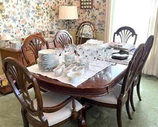 Vintage walnut dining table with brass feet, 6 chairs and 2 leaves. So pretty!