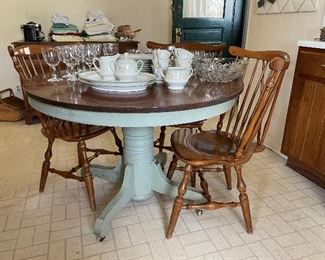 Antique round kitchen table with painted base. Four Ethan Allen dining chairs.