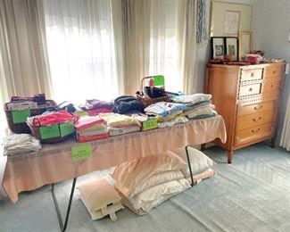 Lots of women's shirts, sweaters, hosiery, belts and slips.