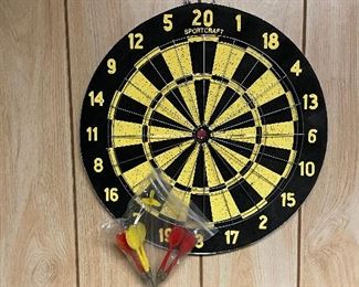 Old school dart board and darts