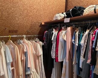 The rack on the left is all nightgowns. On the shelf above are vintage US Navy blue wool and white cotton work uniforms.