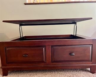 Coffee table with raising top