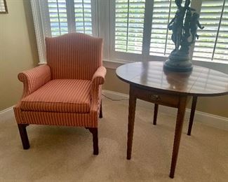 there are a pair of matching Craftique mahogany Pembroke end tables (also pictured is a chair by Hickory Chair)