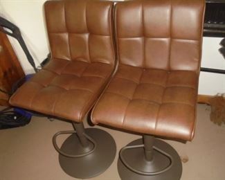 2 brown leather bar stools