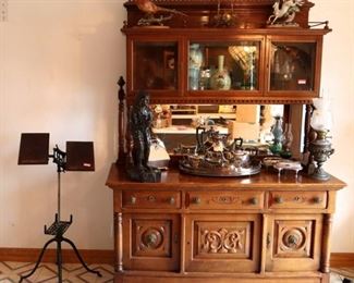 Cherry sideboard ($450), dictionary stand ($100), bronze figure ($100), silverplate tea set ($100) & caster set ($25)