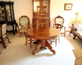 Round Victorian table with two 16in leaves ($450), cane bottom chairs ($50)