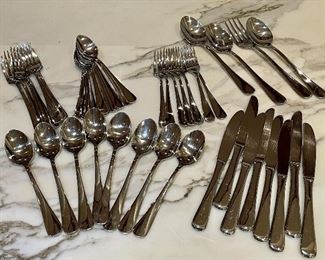 Silverware Set                                                                                            8 knives, 7 forks, 7 salad forks, 11 teaspoons, 8 soup spoons, serving set