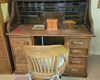 Antique oak roll top desk in oak chair