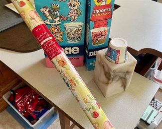 Vintage Dixie cups "Mupet Babies" and Snoopy, Strawberry Shortcake wrapping paper.