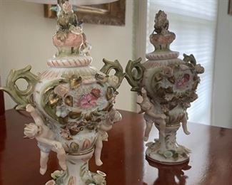 19th Century Dresden (No Mark) Porcelain Mantle Clock Garniture with Putti & Flowers. Set come with Matching Candleholders. One has been Fashioned Into A Lamp. Photo 2 of 2.
