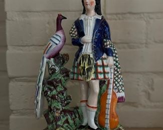 Scottish Staffordshire Porcelain Figurine with Peacock. Measures 14” H x 7” W. Photo 1 of 3.