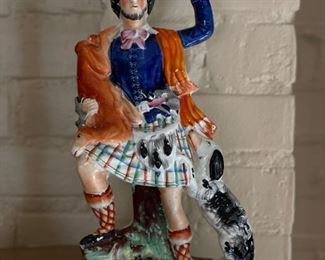 Antique Scottish Staffordshire Figurine with Dog. Measures 14” H x 7” W. Photo 1 of 3.