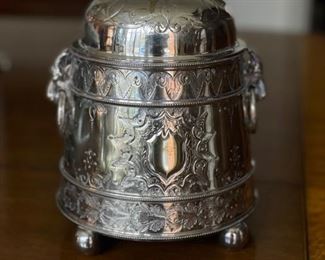 Antique English Biscuit Jar. Silver-Plate with Lilly Pad Engraving. Measures 9” H. Photo 1 of 5.