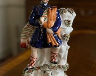Antique Scottish Staffordshire Figurine with Bagpipes. Measures 11" H x 3. 5” W. Photo 1 of 2.